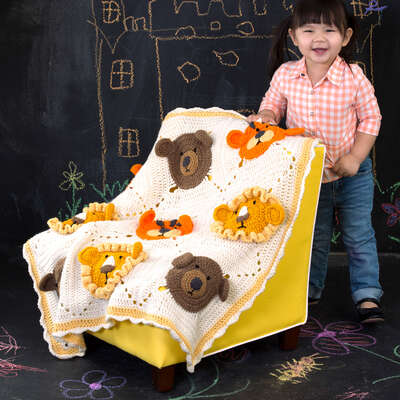 RED HEART LIONS AND TIGERS AND BEARS BLANKET